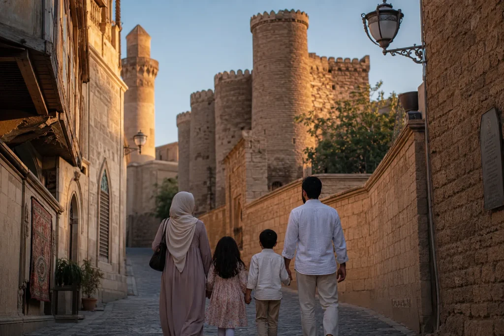 Pakistani Muslim family walking through Baku Old City UNESCO heritage site at golden hour halal family summer trip from Karachi to Azerbaijan 2026 planned by Zaviamo
