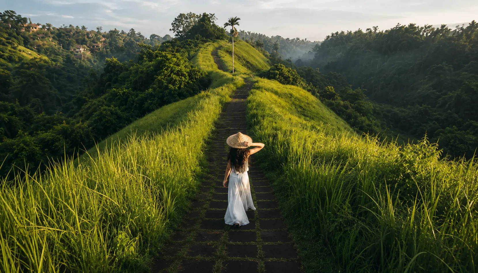 Woman walking Bali hilltop ridge path at sunset, Bali visa for Pakistanis travel destination