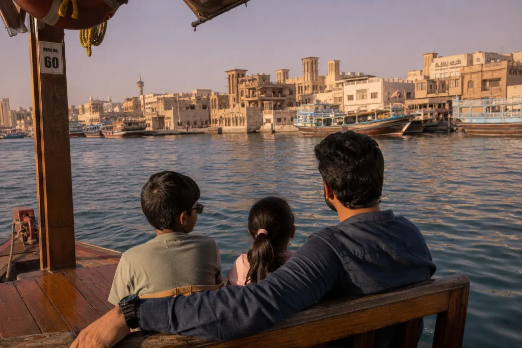 Family on Dubai Creek abra boat ride, Dubai kids go free summer heritage experience