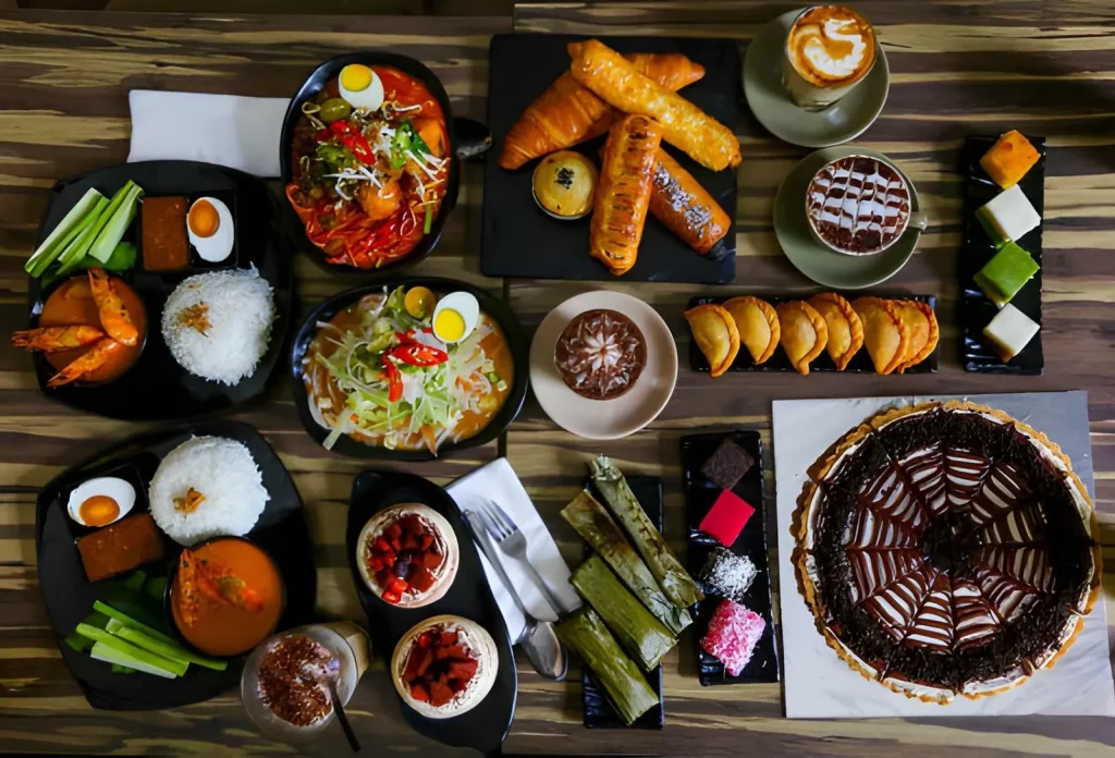 Halal Malaysian food spread with nasi lemak and pastries Malaysia family trip from Pakistan
