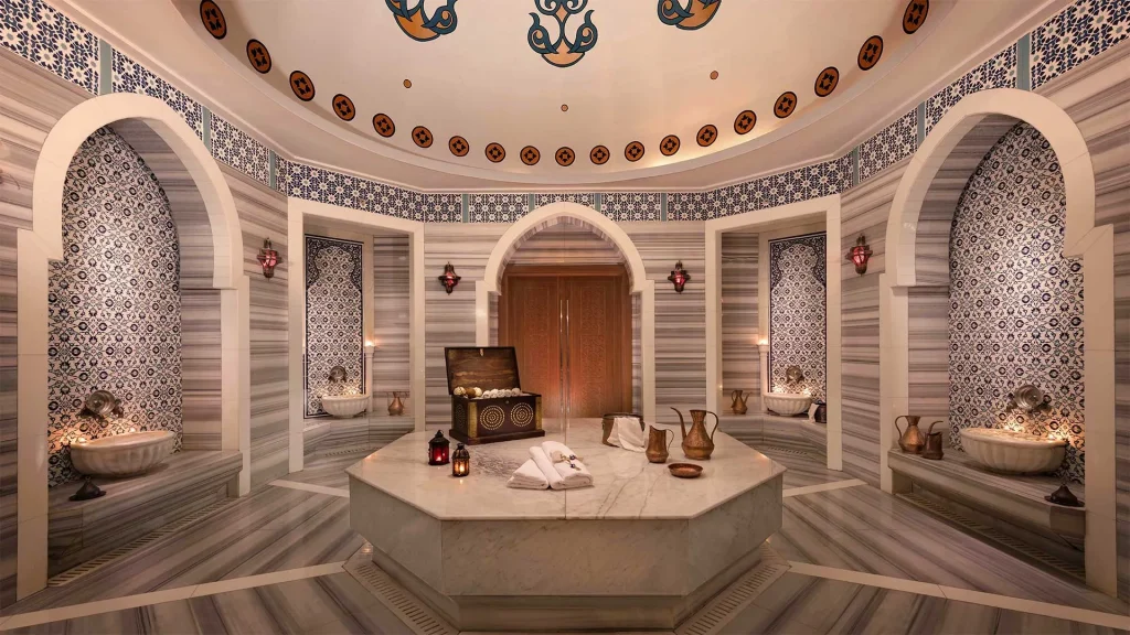 Ornate marble hammam interior with brass pitchers Turkey wellness retreat spa ritual