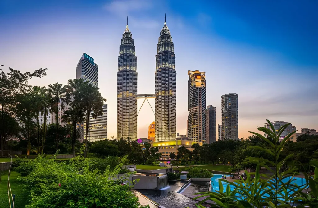 Petronas Twin Towers at dusk from KLCC Park Malaysia family trip from Pakistan