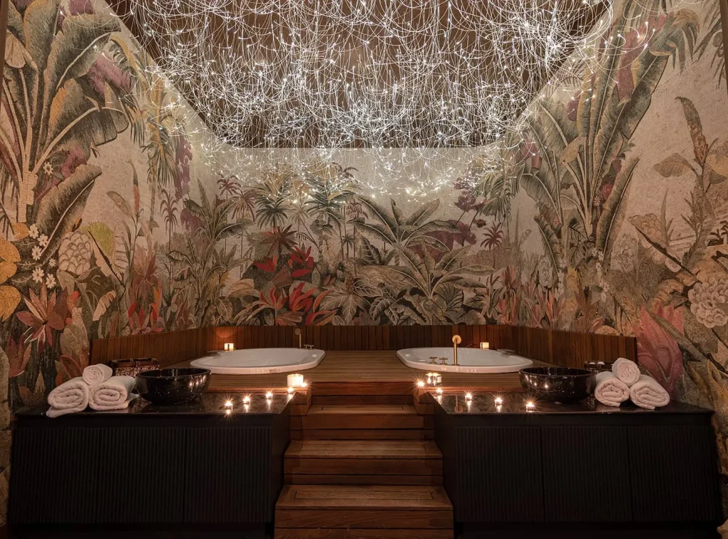Candlelit spa suite with botanical mosaic walls and soaking tubs Turkey wellness retreat