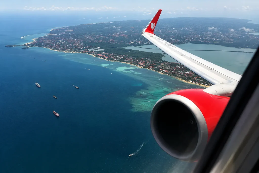 Aircraft window view landing over Bali coastline, Bali visa for Pakistanis arrival card