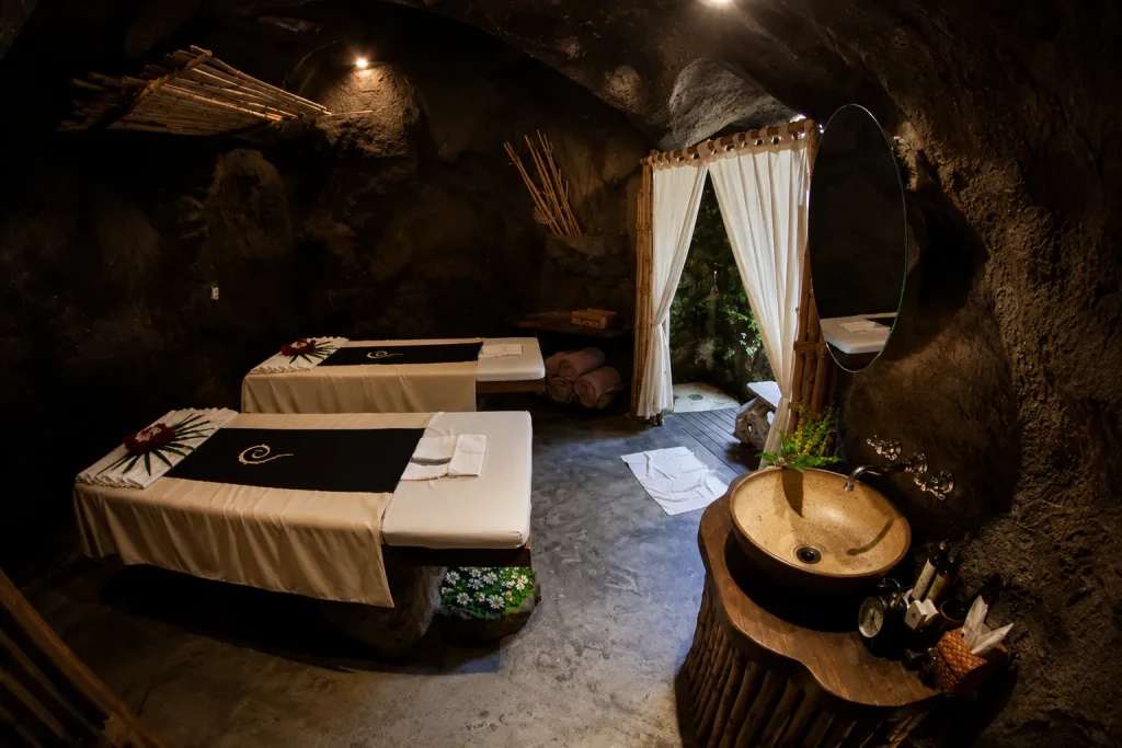 Cave spa treatment room with massage beds, Koh Samui wellness retreat meditation cave