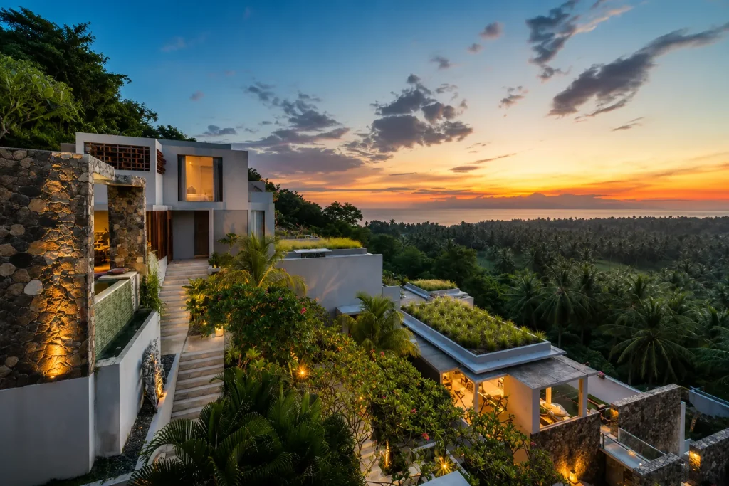 Luxury hillside villa overlooking ocean at sunset, Bali visa for Pakistanis Lombok stay