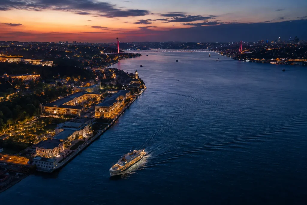 Aerial dusk view of the Bosphorus and palace shoreline near Istanbul luxury hotels