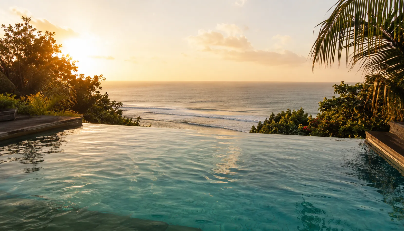 Clifftop infinity pool at sunset in Bali, setting for the Blue Zones wellness retreat