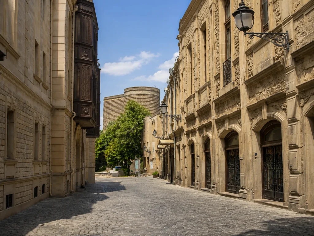 Icherisheher Old City lanes Maiden Tower visible at the end of the lane in Baku, Azerbaijan, a UNESCO stop for Pakistani families