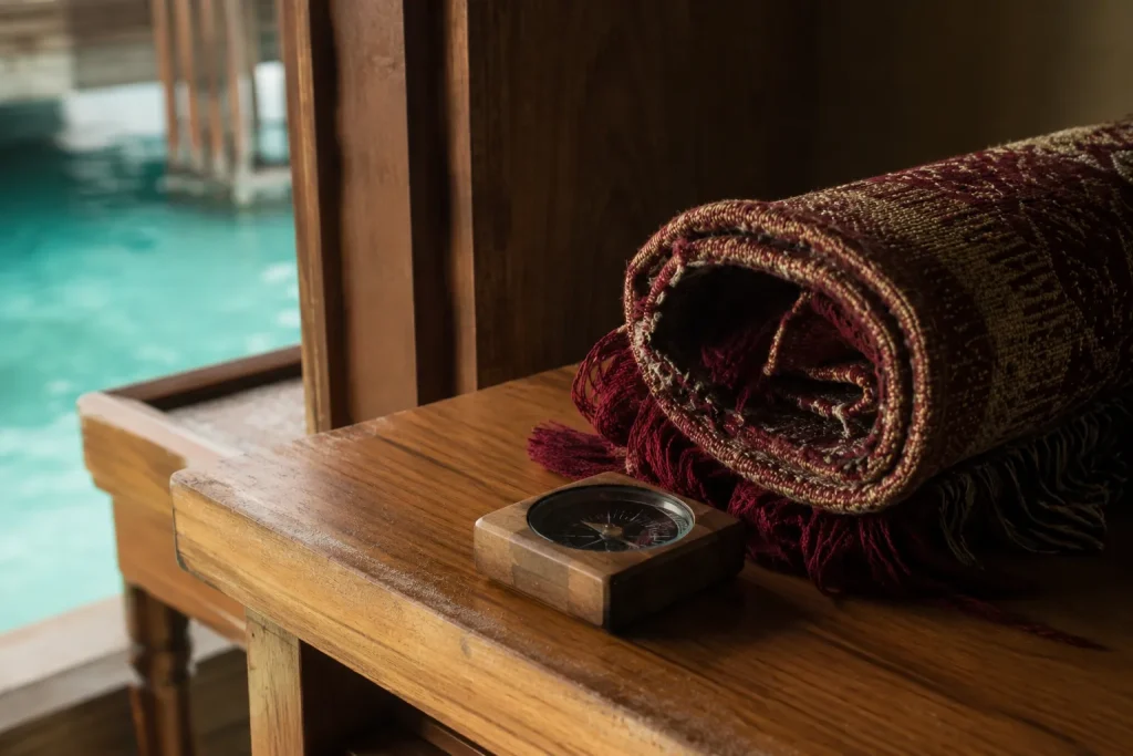 Prayer mat and qibla marker in a Maldives overwater villa, confirmed halal-friendly