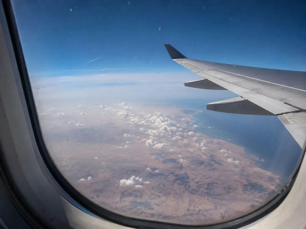 View over Gulf airspace from an aircraft window, the routing risk Karachi travelers face this season | Karachi airport e-gates