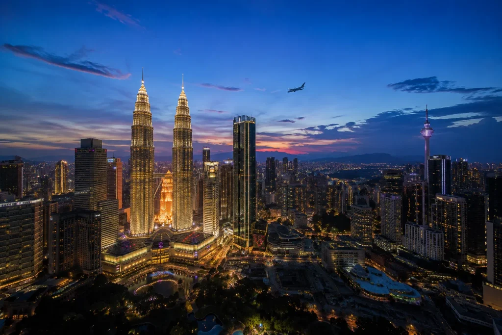 Kuala Lumpur skyline at dusk, a routing stopover for an Indonesia eco luxury resort trip