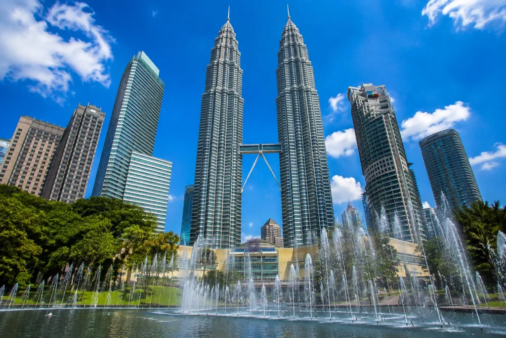 Petronas Towers under clear skies, the destination for a well-timed Malaysia digital nomad visa move.