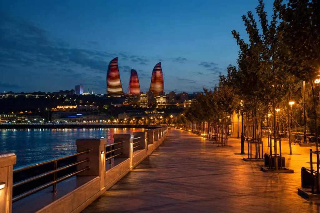 Caspian seafront boulevard in Baku with Flame Towers lit, a stop after your Azerbaijan visa