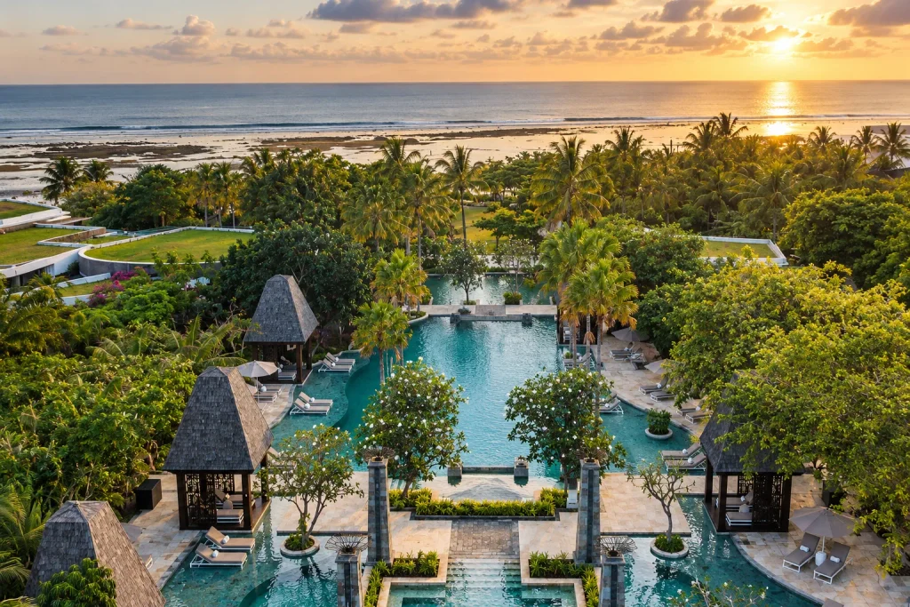 Sunset over a family resort pool in Bali, still a safe December pick despite the flight disruptions