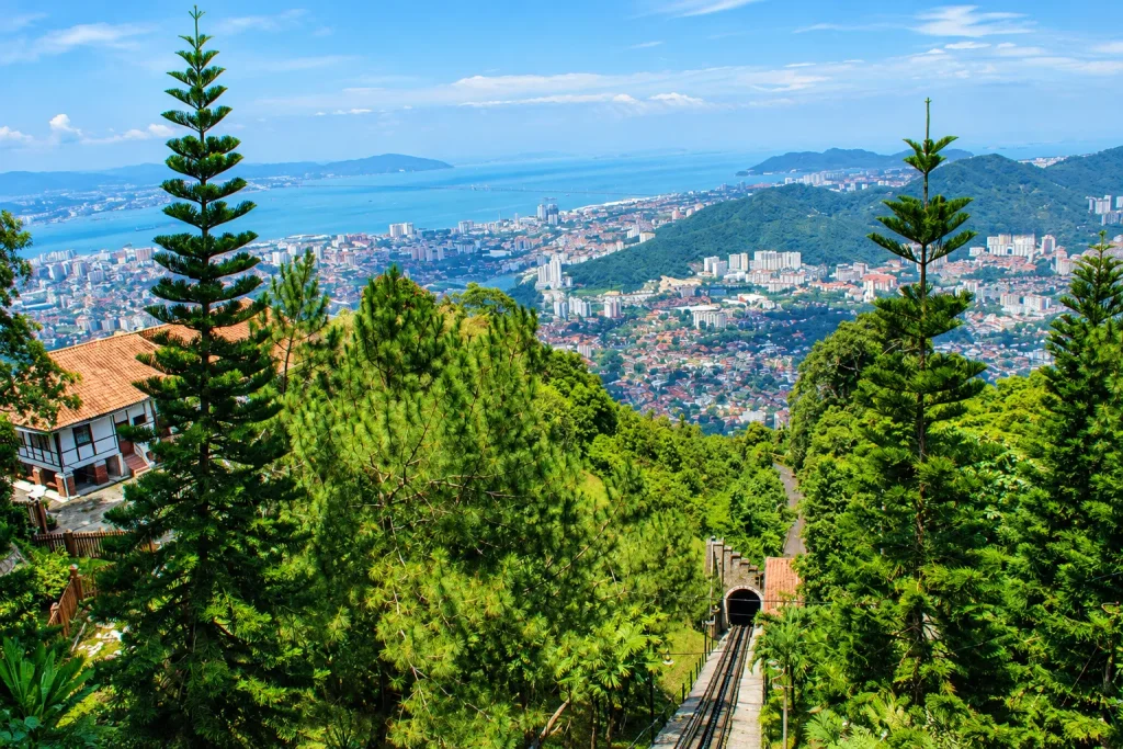 Hilltop view over Penang's coastline and funicular tunnel, a popular day trip stop on a solo Kuala Lumpur trip itinerary.