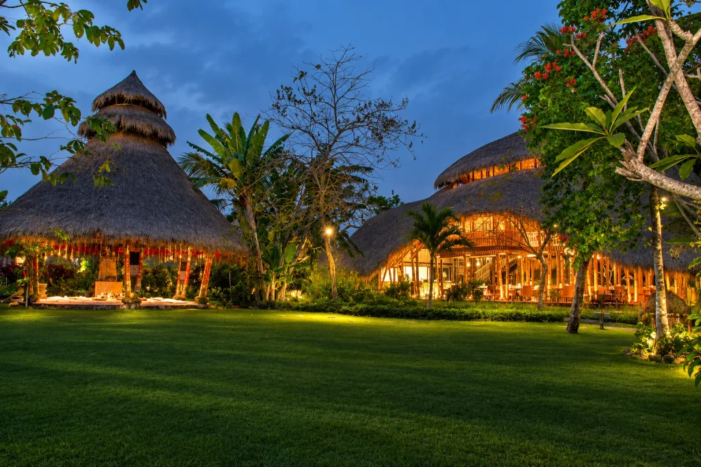 Bamboo retreat pavilions lit at dusk, the wellness stay worth planning a Bali trip from Karachi around