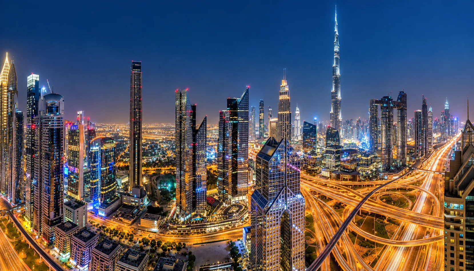 Dubai's skyline lit up at night with the Burj Khalifa, the setting for this year's cheaper Dubai winter break rates