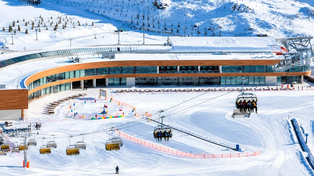 Ski resort base lodge with chairlifts and a kids’ practice area on an Azerbaijan ski trip