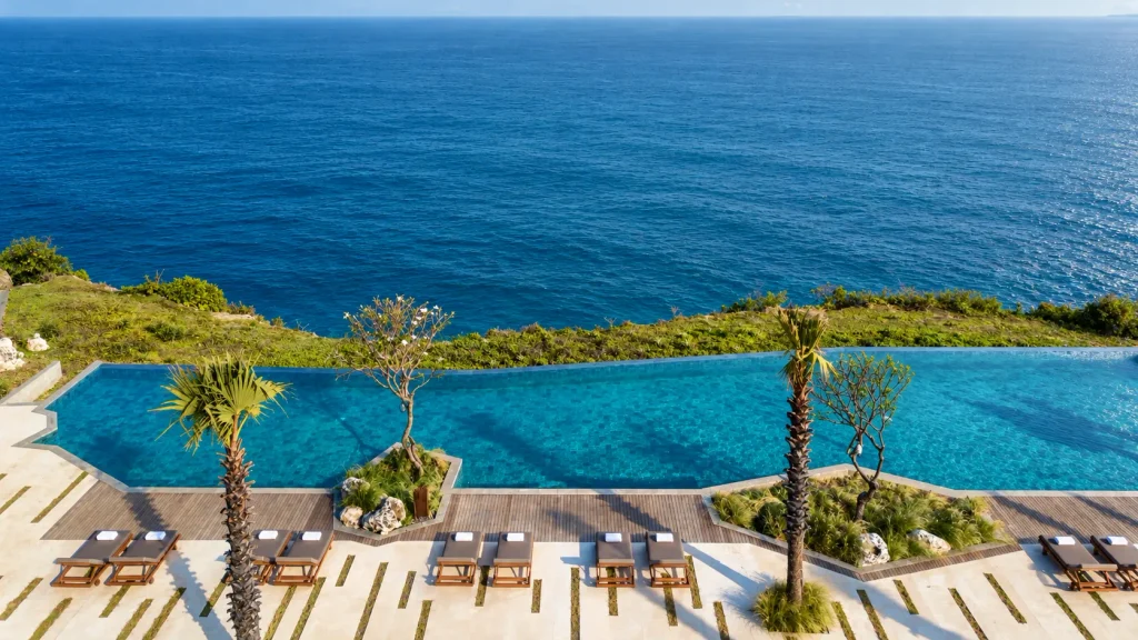 Hillside villa pool overlooking jungle and sea, a rainy-season Bali Christmas villa retreat
