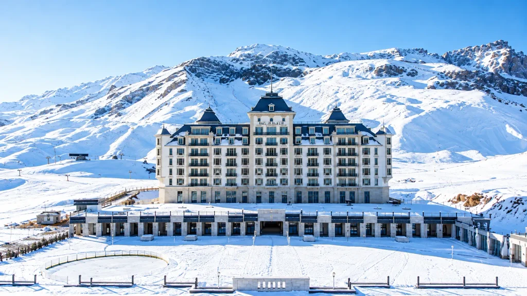 Grand alpine hotel beneath snowy Caucasus peaks, a mountain stay for an Azerbaijan ski trip