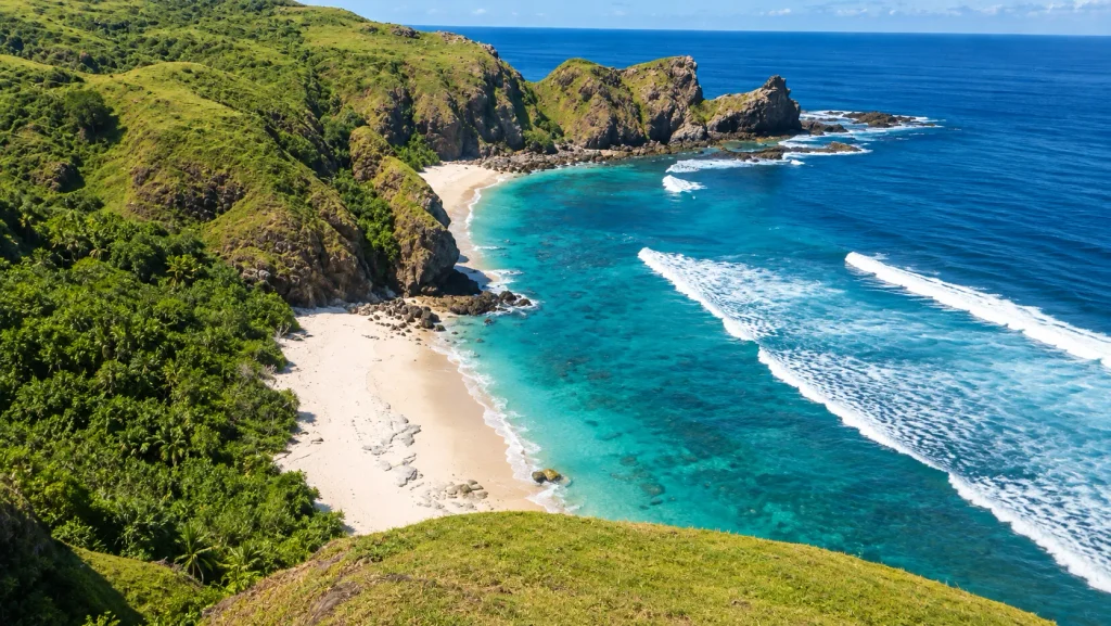 Secluded white-sand cove below green cliffs, a beach escape from a Bali Christmas villa